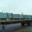 Motor silencers loaded onto a truck.