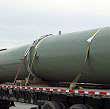 Several natural gas vent silencers loaded on a truck for shipping.